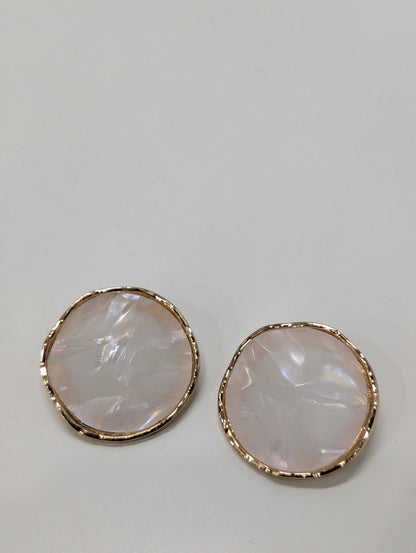Pair of round stud earrings with textured gold-tone rims and smooth iridescent off-white centres