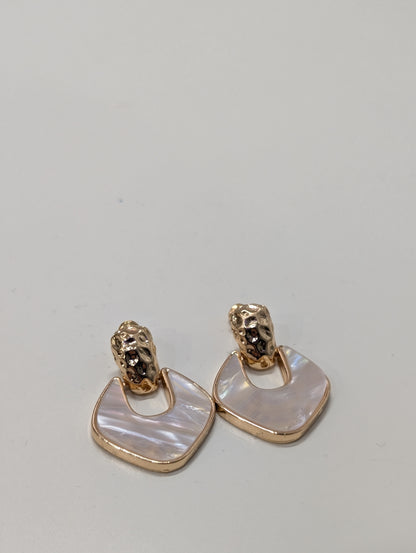 Earrings with a textured gold-tone top and a rounded-square drop edged in gold-tone, containing a pale pearlescent pink-white inset.